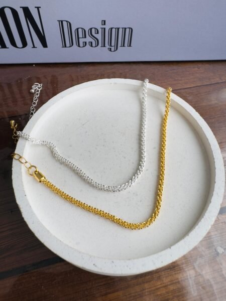 Pulseira Torcida em elos quadrados Banhada